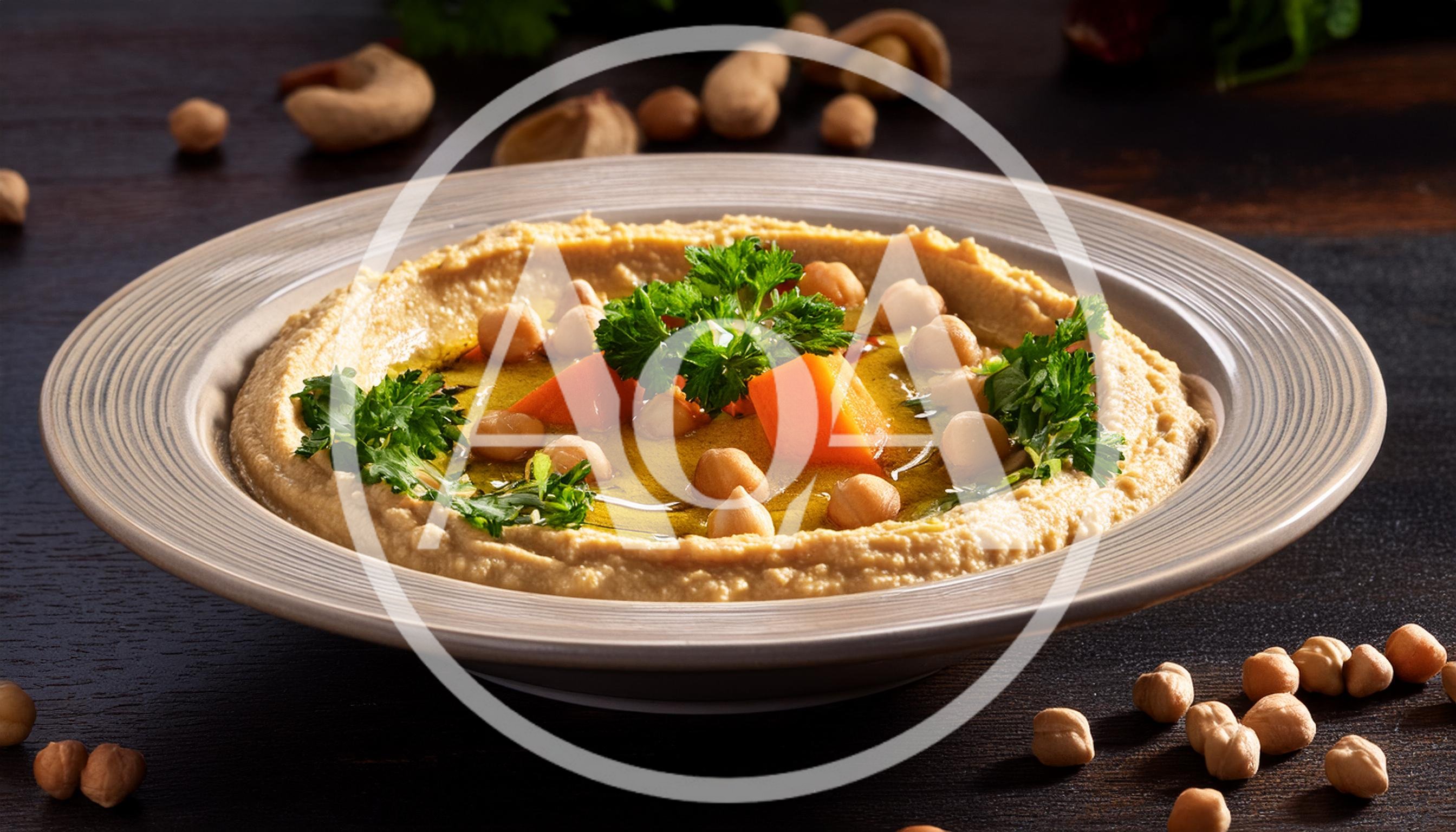 Hummus Bowl Garnished With Chickpeas And Fresh Parsley