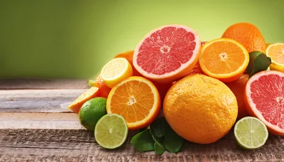 Assorted Fresh Citrus Fruits on Rustic Wooden Table