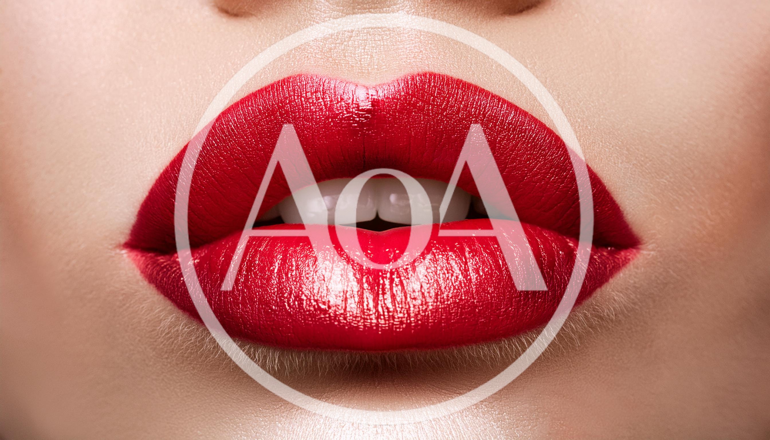 Close Up Of Woman Wearing Vibrant Red Lipstick