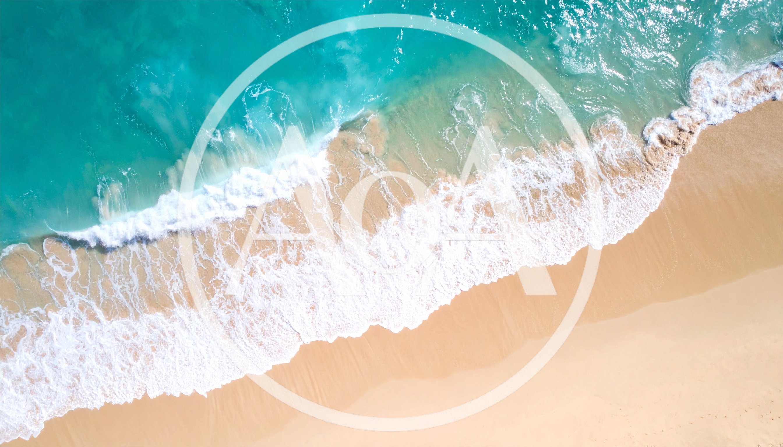 Aerial View Of Turquoise Ocean Waves Crashing On Beach