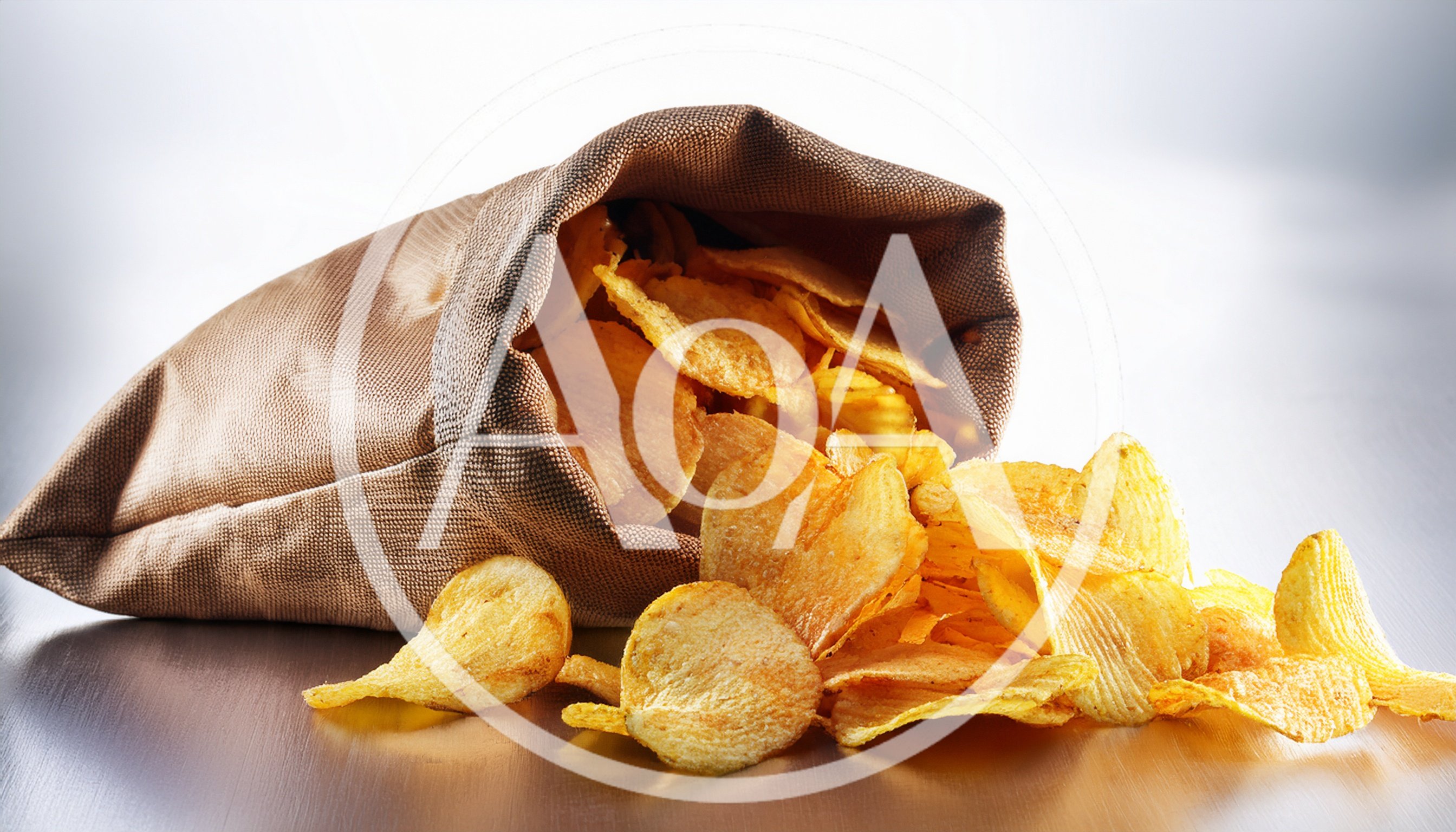 Potato Chips Spilling From A Brown Fabric Sack