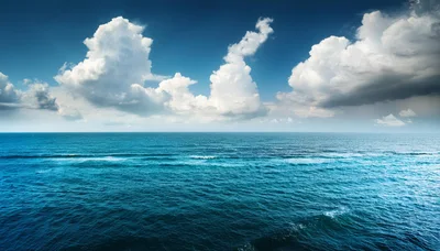 Vast Blue Ocean Under A Dramatic Cloudy Sky