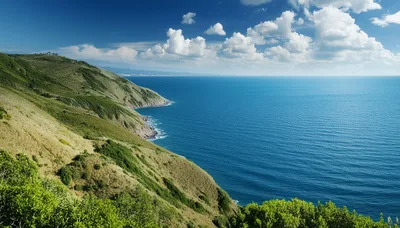 Coastal Landscape With Green Hills And Blue Ocean