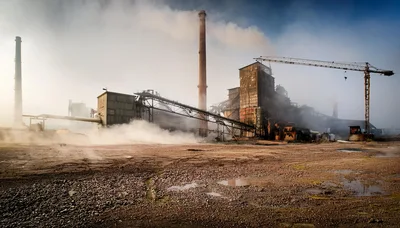 Industrial Factory Complex With Smoking Chimneys And Crane