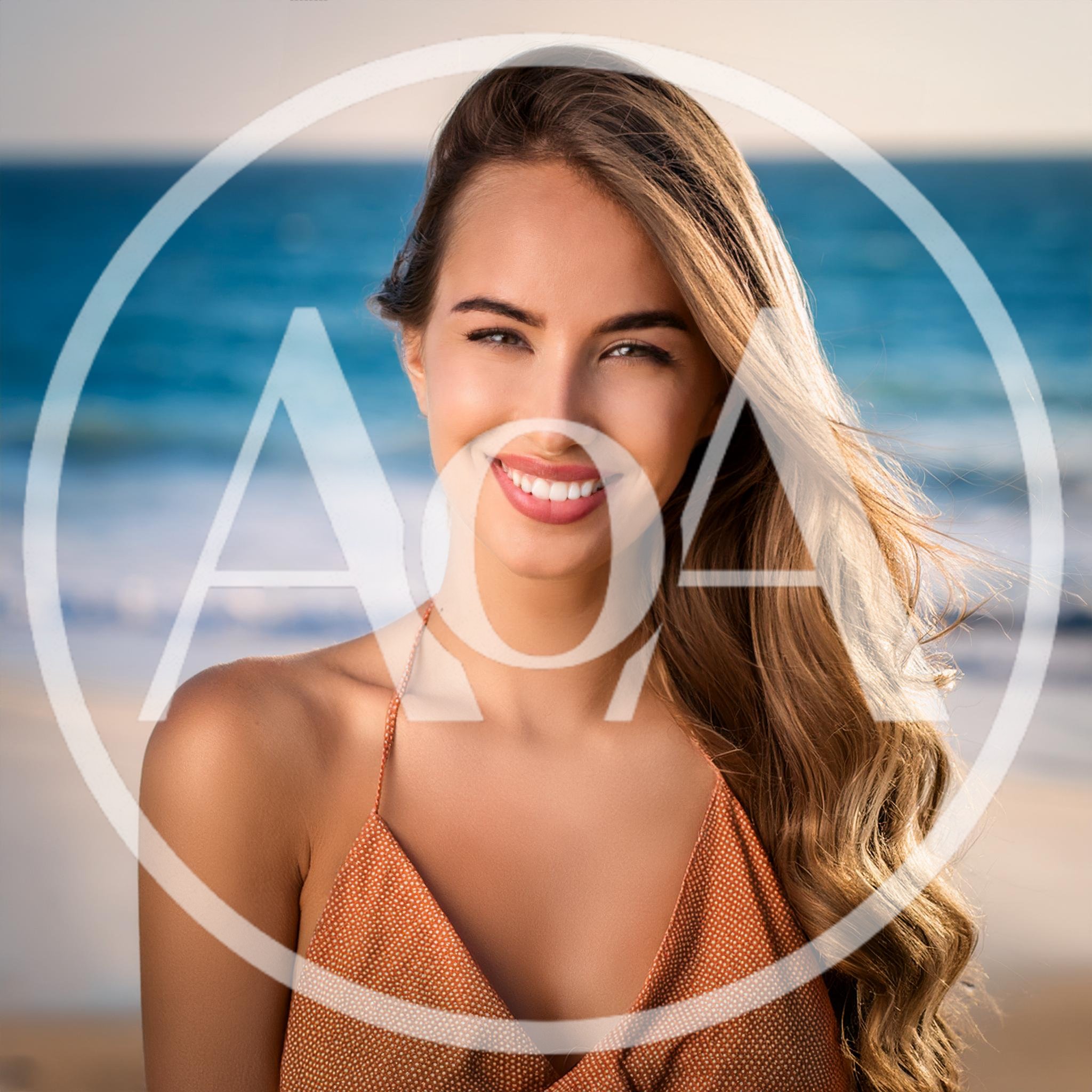 Smiling Young Woman Posing On A Sunny Beach