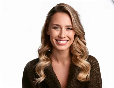Portrait Of A Smiling Young Woman With Blonde Hair