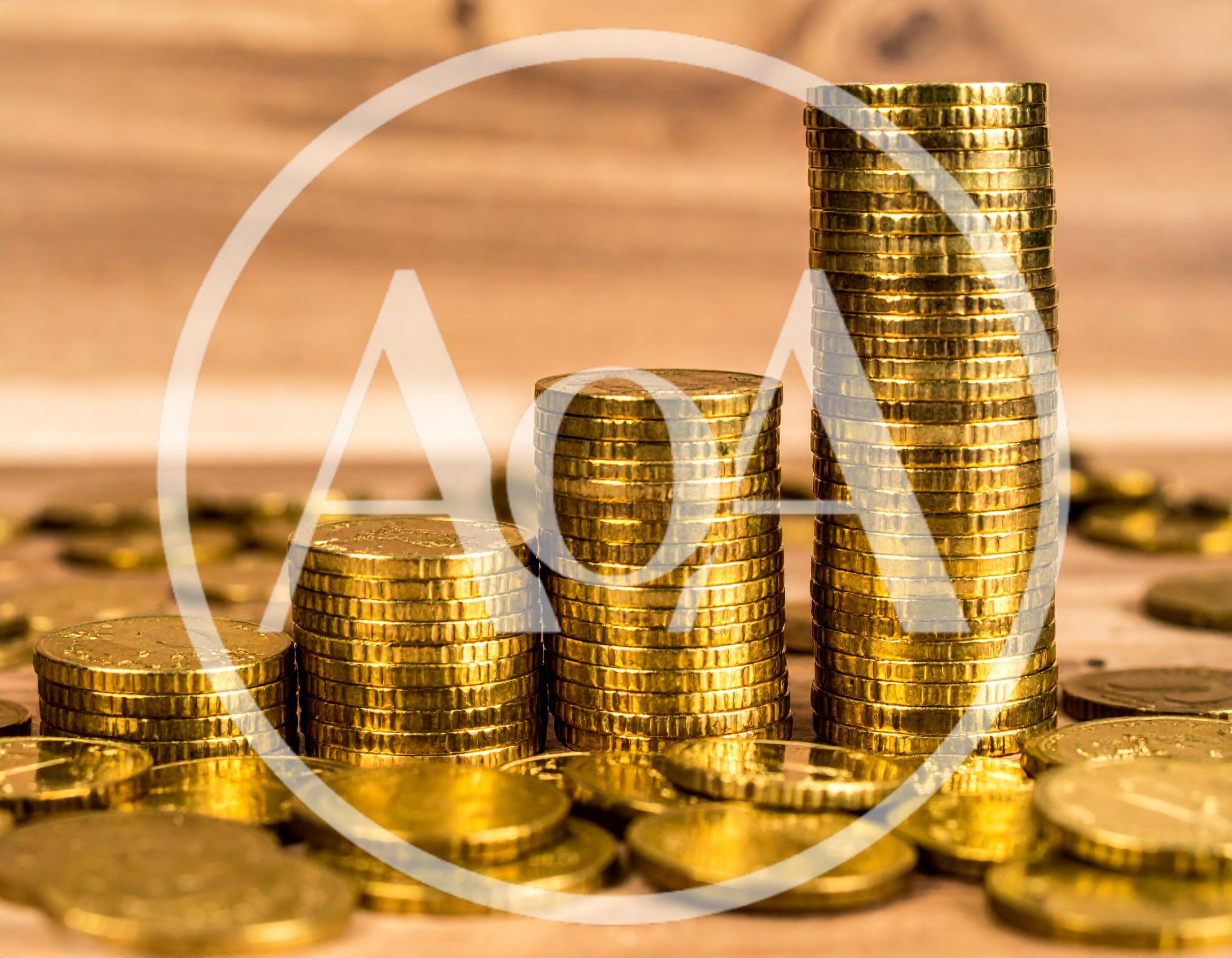 Three Stacks Of Gold Coins On Wooden Surface