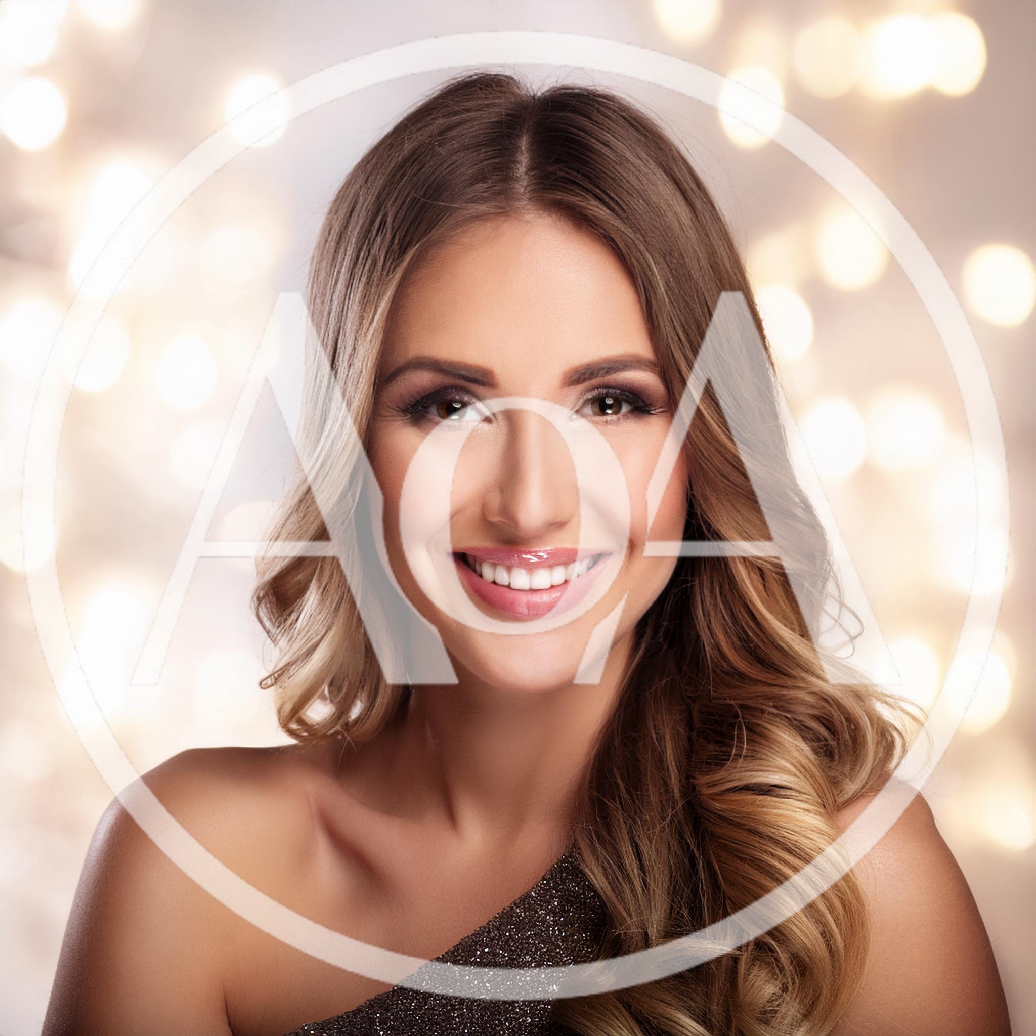 Portrait Of A Smiling Woman With Wavy Hair