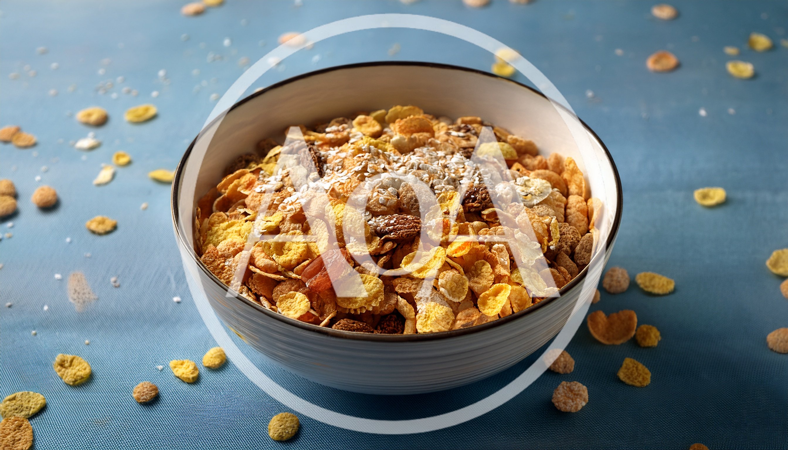 Bowl Of Crunchy Breakfast Cereal On Blue Surface