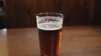 Pint Of Amber Ale On A Wooden Table