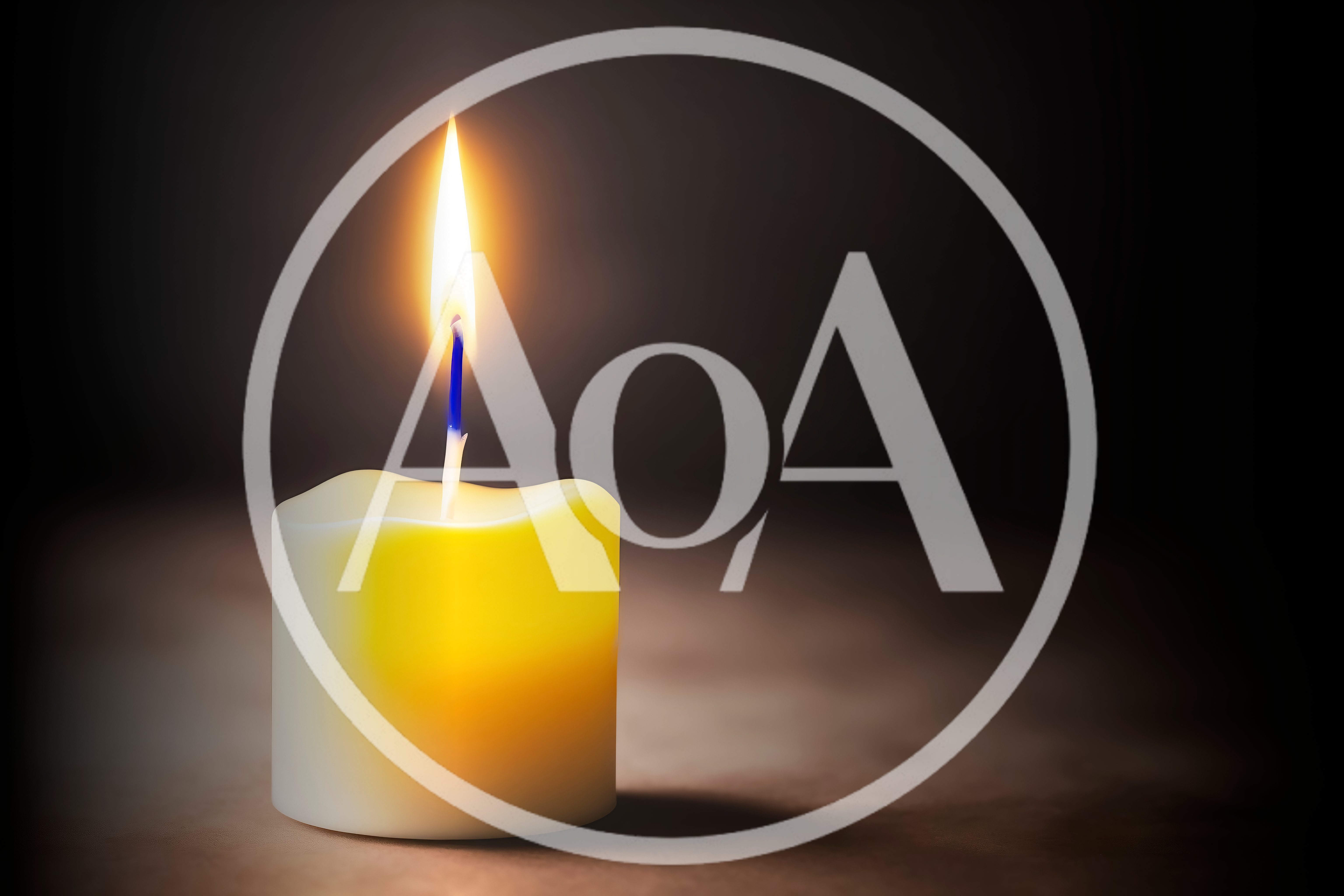 Single Lit Candle With Glowing Flame