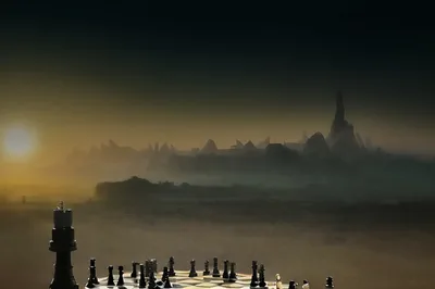 Surreal Chessboard Landscape With Distant Foggy City