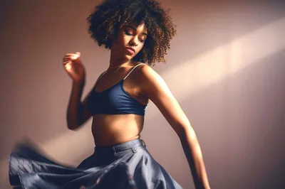 Young Woman Dancing In A Flowing Skirt