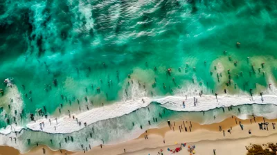 Aerial View Of Crowded Tropical Beach With Surfers