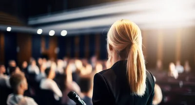 Businesswoman Giving A Presentation To An Audience
