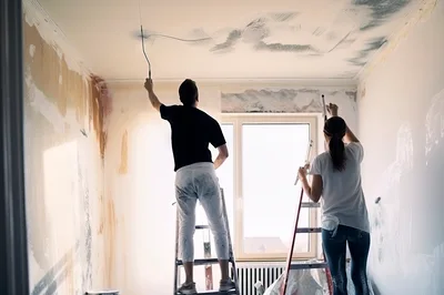 Couple Renovating And Painting Their New Home Interior
