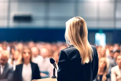 Businesswoman Giving A Presentation At A Conference