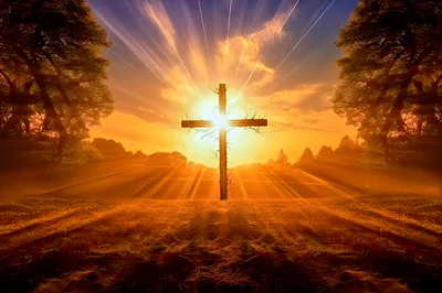 Wooden Cross Standing In A Radiant Golden Sunset