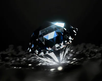 Brilliant Cut Diamond Resting On Dark Reflective Surface