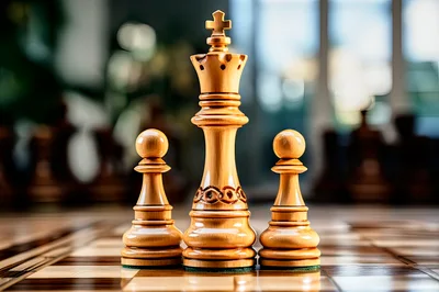 Wooden Chess King and Two Pawns on Board